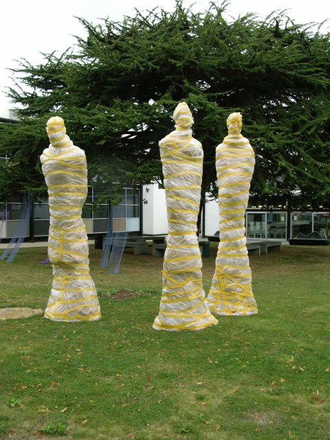 The wrapped monumental statues out on the lawn at UCCA Canterbury campus