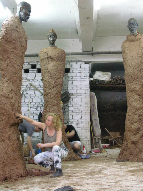 Working details on one of the monumental Artists of the Silk Road sculptures in clay