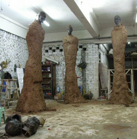 A view of all 3 monumental statues in clay in the Chinese sculpture studio